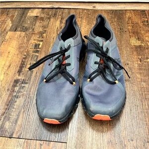 On Running Gray and Black Athletic Shoes with Orange Accents